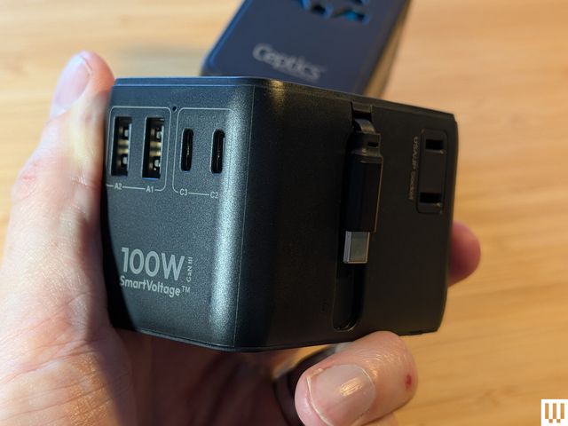 Image may contain Adapter Electronics Mobile Phone and Phone